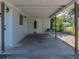 This is the carport area, offering covered parking and additional storage space at 1205 Crestwood Dr, Winter Haven, FL 33881
