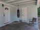 This carport area features a punching bag, offering a unique space at 1205 Crestwood Dr, Winter Haven, FL 33881