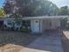Charming single-story house with covered parking and drought resistant landscaping at 1205 Crestwood Dr, Winter Haven, FL 33881