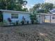 This is a charming one-story home with a well-maintained front yard at 1205 Crestwood Dr, Winter Haven, FL 33881