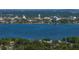 Picturesque waterfront view of a city skyline and lush landscape along the water's edge at 1205 Crestwood Dr, Winter Haven, FL 33881