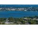 Scenic view of a tranquil waterfront featuring an urban skyline and lush vegetation at 1205 Crestwood Dr, Winter Haven, FL 33881