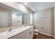Bright bathroom with double sinks, tile flooring, and shower at 1752 Frogmore Ave, Haines City, FL 33844