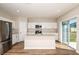 Bright kitchen featuring stainless steel appliances, a center island, and sliding glass doors at 1752 Frogmore Ave, Haines City, FL 33844
