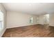 Spacious living room with wood-look floors and ample natural light at 1752 Frogmore Ave, Haines City, FL 33844