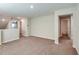 Open loft space with neutral carpeting and access to multiple rooms at 1752 Frogmore Ave, Haines City, FL 33844