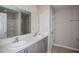 Bathroom featuring a double sink vanity and a large mirror at 1756 Frogmore Ave, Haines City, FL 33844