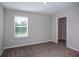 Bedroom features a window providing natural light, and an attached closet at 1756 Frogmore Ave, Haines City, FL 33844