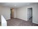 Upstairs hallway with neutral carpeting and neutral paint at 1756 Frogmore Ave, Haines City, FL 33844