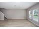 An open living space with hardwood floors and staircase at 1756 Frogmore Ave, Haines City, FL 33844