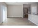 Open-concept living space featuring hardwood floors, and a kitchen at 1756 Frogmore Ave, Haines City, FL 33844