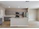 Kitchen featuring stainless steel appliances, gray cabinets, and a large center island at 1760 Frogmore Ave, Haines City, FL 33844