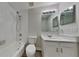 Bathroom with a tub and shower combination and a vanity with modern fixtures at 210 Alta Vista St, Debary, FL 32713