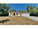 Charming single-story home featuring brick accents, attached two-car garage, and a well-maintained lawn at 210 Alta Vista St, Debary, FL 32713