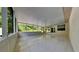 Enclosed patio featuring tile floors and screens providing outdoor views at 210 Alta Vista St, Debary, FL 32713