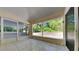 Enclosed patio featuring tile floors and screens providing outdoor views at 210 Alta Vista St, Debary, FL 32713