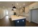 Modern kitchen with stainless steel appliances and large island at 6069 Sacred Oak Ave, Mount Dora, FL 32757
