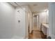 Modern bathroom featuring a glass-enclosed shower, vanity with sink, and access to an adjacent walk-in closet at 1046 Foreshore Ln, Haines City, FL 33844