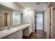 Bright bathroom with double sinks, quartz countertops, and a shower-tub combo, perfect for modern living at 1046 Foreshore Ln, Haines City, FL 33844
