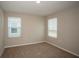 Comfortable bedroom with two windows allowing ample natural light into the space at 1046 Foreshore Ln, Haines City, FL 33844