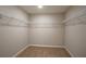 Empty walk-in closet featuring wire shelving for organized storage in this modern home at 1046 Foreshore Ln, Haines City, FL 33844