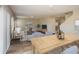 Open-concept living space and dining area featuring a cozy living room, dining table, and modern decor at 1046 Foreshore Ln, Haines City, FL 33844