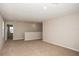 Upstairs loft area with neutral carpeting and walls, offers versatile space for relaxation or entertainment at 1046 Foreshore Ln, Haines City, FL 33844