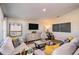 Living room featuring a decorative fireplace and neutral decor with yellow accent pillows at 1054 Foreshore Ln, Haines City, FL 33844