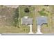 An aerial view of a single-Gathering home highlighting the large lot, driveway and neighboring houses at 326 Marion Oaks Trl, Ocala, FL 34473