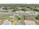A captivating aerial view of a single story home with a large lot and beautiful landscaping at 326 Marion Oaks Trl, Ocala, FL 34473