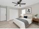 This bedroom has a ceiling fan, neutral paint color, and a double door closet for storage at 326 Marion Oaks Trl, Ocala, FL 34473