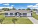 Charming single-story home with a well-maintained lawn on a beautiful sunny day at 326 Marion Oaks Trl, Ocala, FL 34473