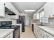 Bright kitchen featuring white cabinets, modern appliances, and plenty of counter space at 326 Marion Oaks Trl, Ocala, FL 34473