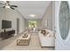 Living room boasting vaulted ceilings, modern decor, and slider to the backyard at 326 Marion Oaks Trl, Ocala, FL 34473