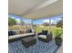 Enjoy your screened patio with comfortable furniture and views of the backyard at 326 Marion Oaks Trl, Ocala, FL 34473