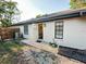 Exterior view of home with fenced backyard and a tiled patio at 1507 Wheeler Rd, Apopka, FL 32703