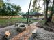Spacious backyard with patio, stone seating, and fire pit at 1507 Wheeler Rd, Apopka, FL 32703