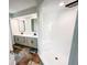 Modern bathroom with a large, white, walk-in shower, double vanity, and gray cabinets at 1507 Wheeler Rd, Apopka, FL 32703