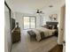 Bedroom with large sliding glass doors to backyard, ceiling fan, and soft carpet at 1507 Wheeler Rd, Apopka, FL 32703