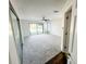 Spacious bedroom filled with light, features plush carpet, sliding glass doors to backyard, and a ceiling fan at 1507 Wheeler Rd, Apopka, FL 32703