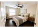 Bright bedroom features a ceiling fan and a large window for natural light at 1507 Wheeler Rd, Apopka, FL 32703