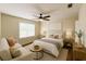 Inviting bedroom with large bed, stylish seating, and a bright window at 1507 Wheeler Rd, Apopka, FL 32703