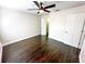 Inviting bedroom featuring a ceiling fan, closet, and hardwood flooring, creating a cozy atmosphere at 1507 Wheeler Rd, Apopka, FL 32703
