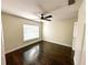 Bright, airy bedroom with hardwood floors and a ceiling fan, offering a comfortable living space at 1507 Wheeler Rd, Apopka, FL 32703