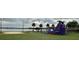 Lakeside community area with playground inflatables, picnic pavilions, and a volleyball court at 1507 Wheeler Rd, Apopka, FL 32703