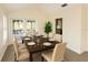 Well-lit dining room with neutral colors, and glass patio doors at 1507 Wheeler Rd, Apopka, FL 32703