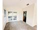 Bright, carpeted bonus room with French doors leading to outdoor patio at 1507 Wheeler Rd, Apopka, FL 32703