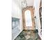 Bright foyer features brick accent wall, slate floors, and a modern light fixture at 1507 Wheeler Rd, Apopka, FL 32703
