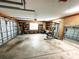 A tidy, organized garage featuring an exercise machine, and shelves for storage at 1507 Wheeler Rd, Apopka, FL 32703