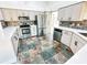 Updated kitchen features stainless appliances, granite counters and custom cabinets at 1507 Wheeler Rd, Apopka, FL 32703